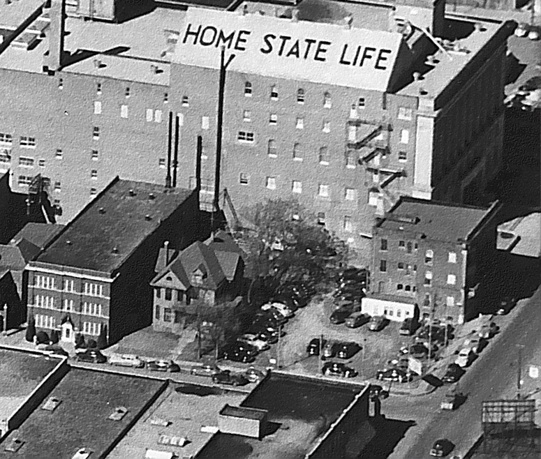 The unassuming tree in a family’s backyard in 1947. The building directly behind now houses the Memorial Museum.